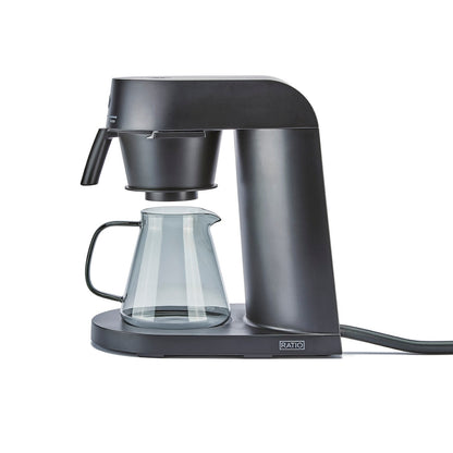 Black ratio 4 coffee machine with glass carafe on a white background