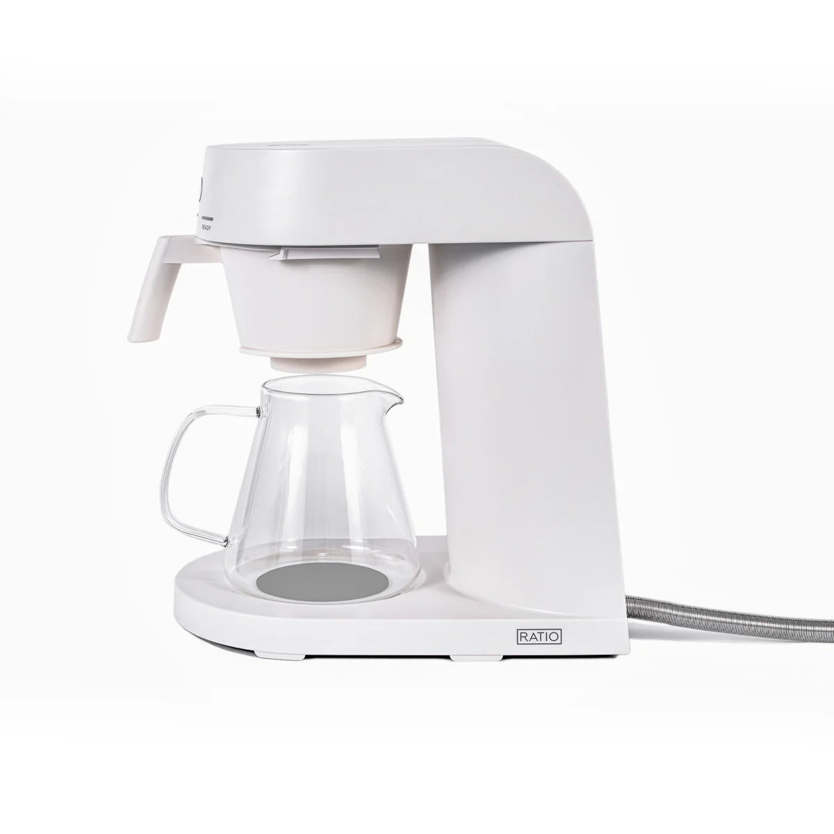 White coffee maker with glass carafe on a white background