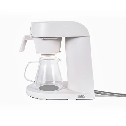 White coffee maker with glass carafe on a white background