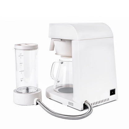 White coffee machine with glass carafe on a white background